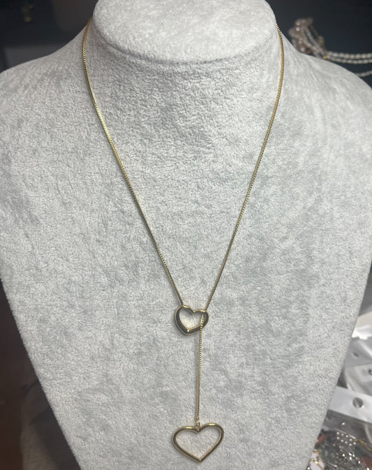 Collana cuori collegati a cascata dorata, due pendenti cuore su catena fine, acciaio placcato oro