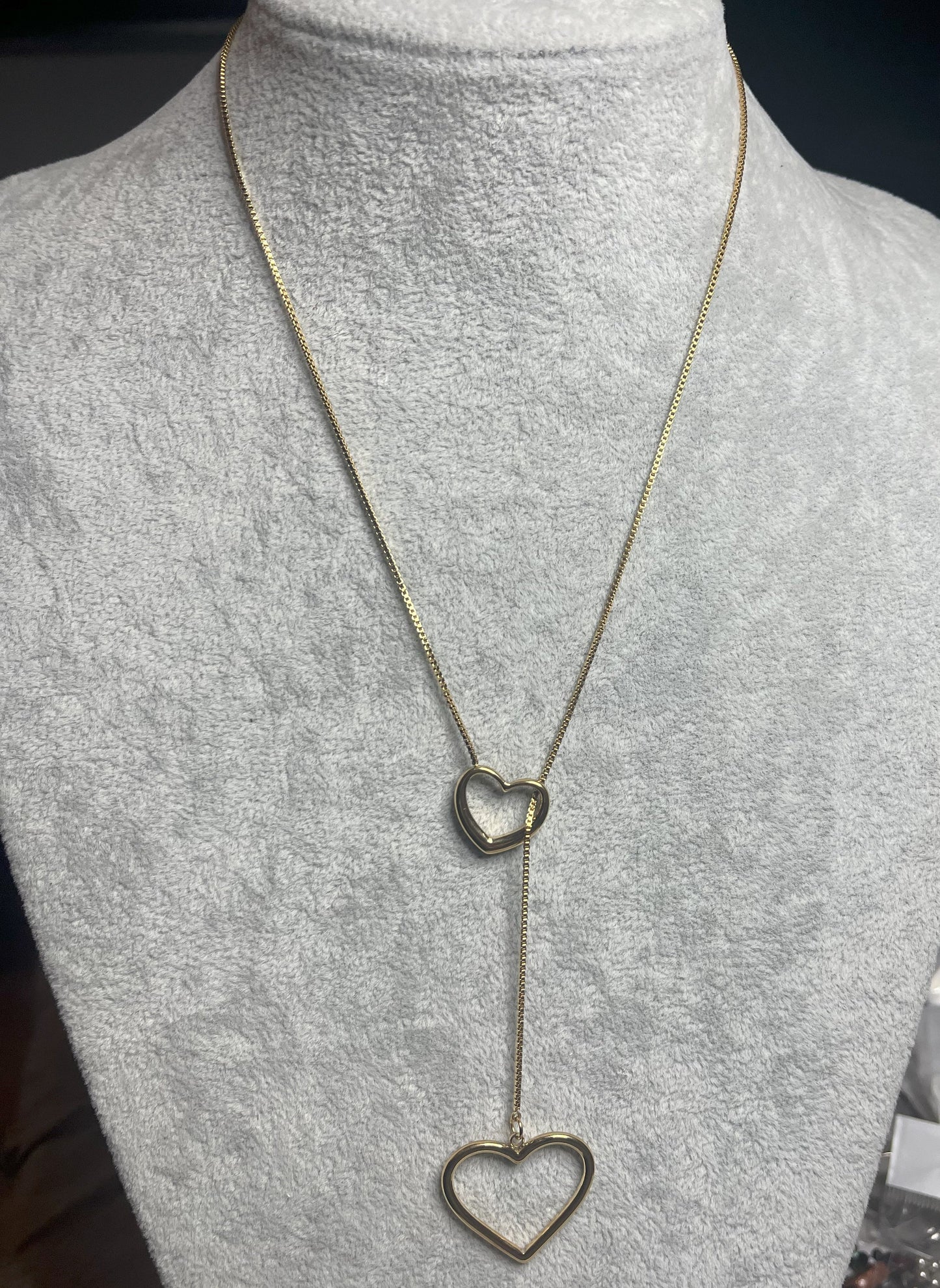 Collana cuori collegati a cascata dorata, due pendenti cuore su catena fine, acciaio placcato oro