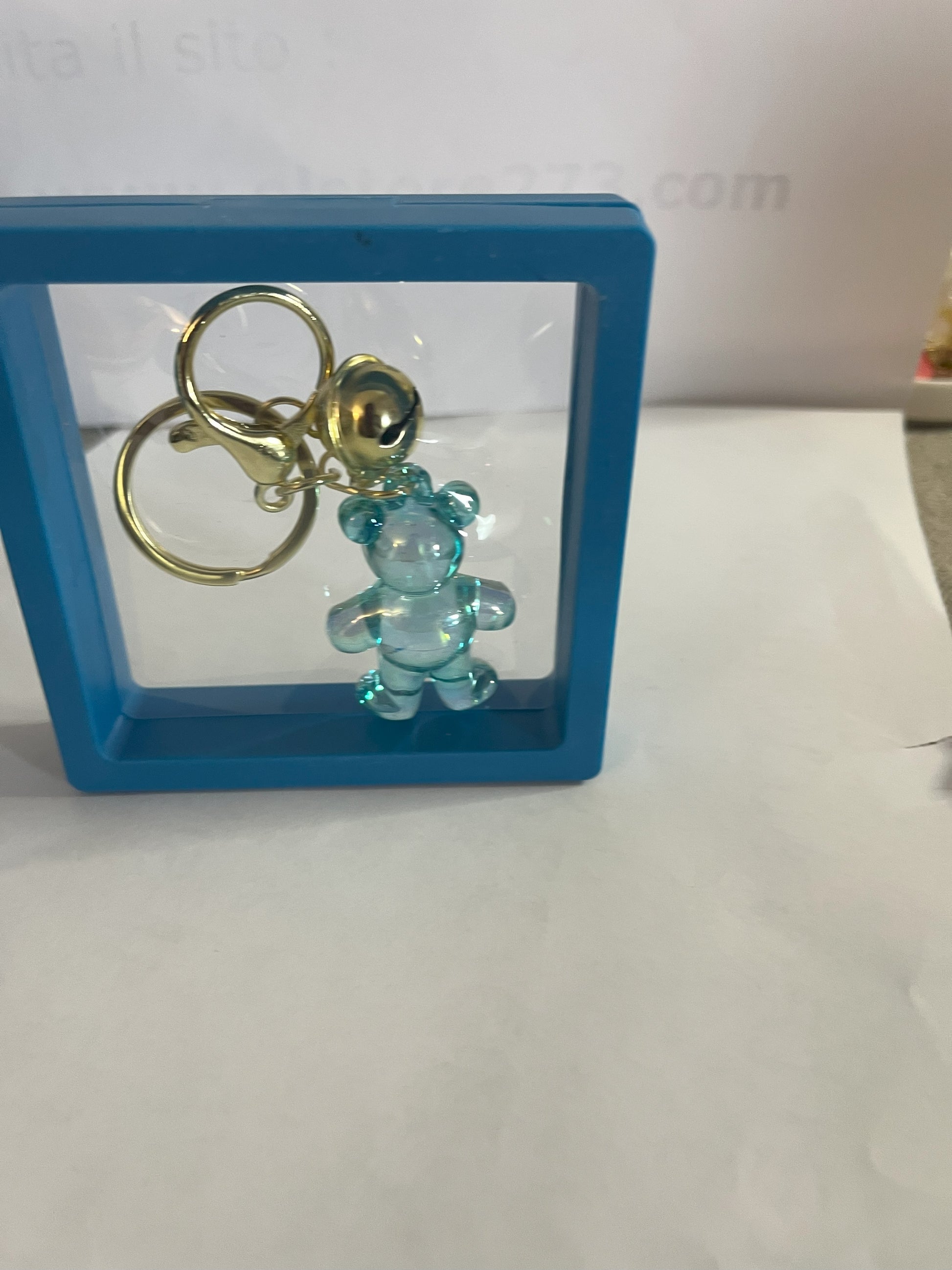 Portachiavi Teddy trasparente con orsetto colorato e moschettone dorato