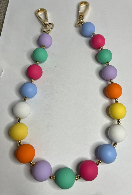 Accessorio multifunzione Color Pop Style con sfere multicolore e dettagli dorati, utilizzabile come collana, tracolla per borsa o accessorio decorativo